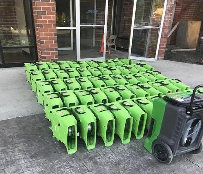 SERVPRO water equipment sitting outside in front of a building
