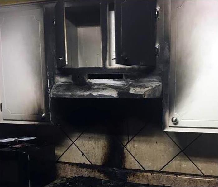 Soot and fire damage on kitchen cabinets 