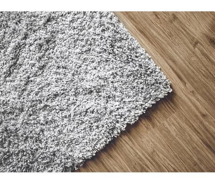 carpeting edge on top of hardwood floors