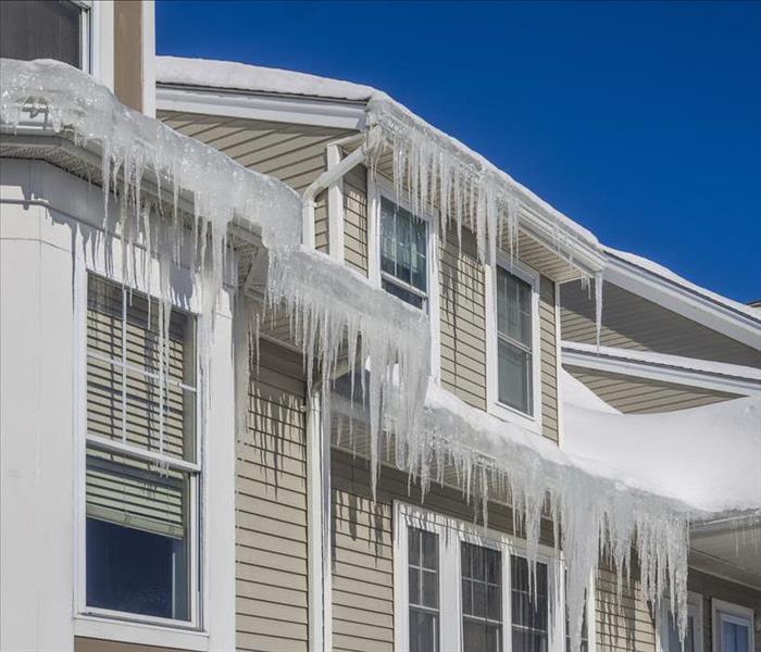 icicles on gutters of house 