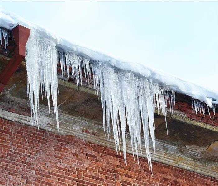 ice dam and icicles on a roof