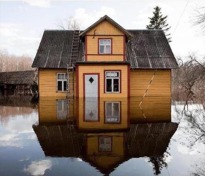 Floodwater surrounding home